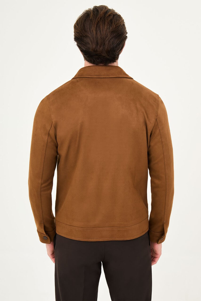 Men's camel suede-style jacket styled with a black sweater and dark trousers.