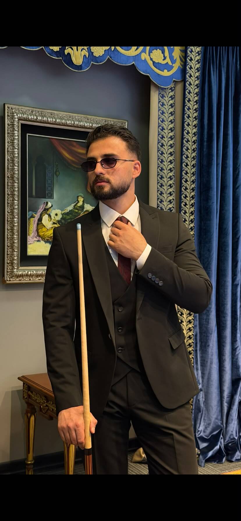 Men’s black three piece suit with tailored jacket, matching waistcoat, notch lapels, and formal trousers for weddings, business events, and elegant occasions.