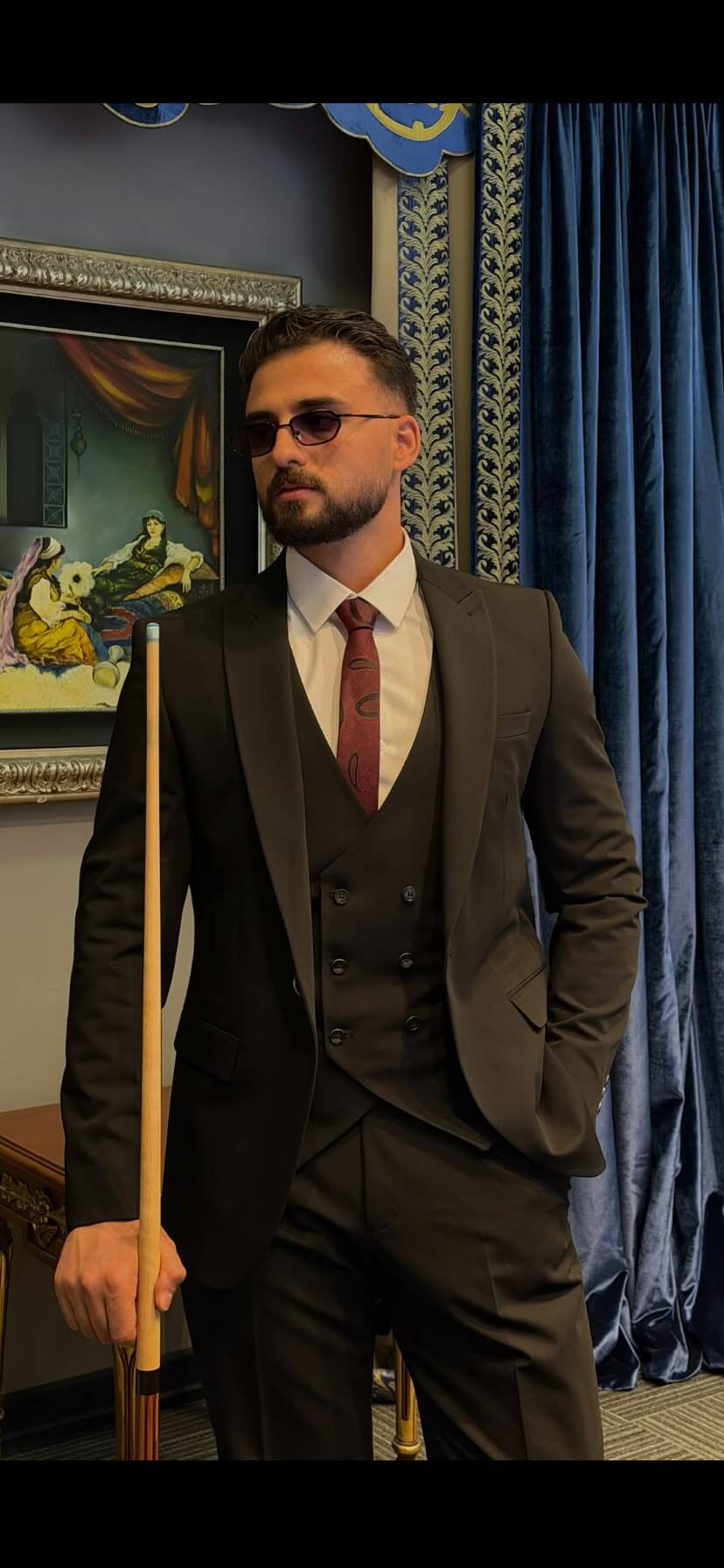 Men’s black three piece suit with tailored jacket, matching waistcoat, notch lapels, and formal trousers for weddings, business events, and elegant occasions.