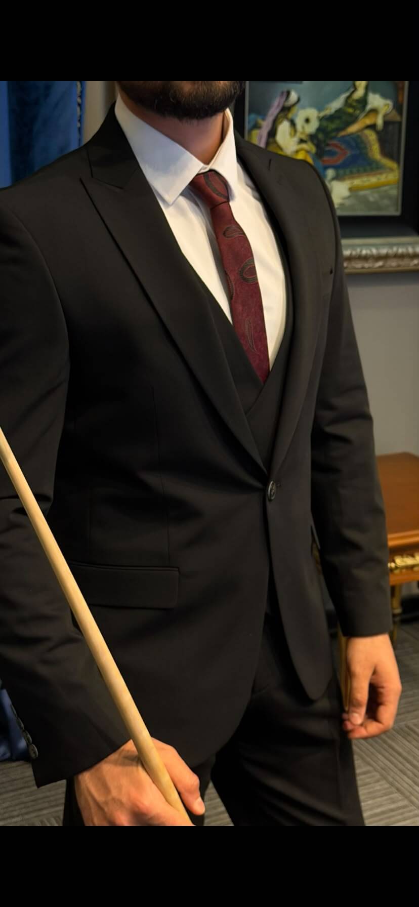 Men’s black three piece suit with tailored jacket, matching waistcoat, notch lapels, and formal trousers for weddings, business events, and elegant occasions.
