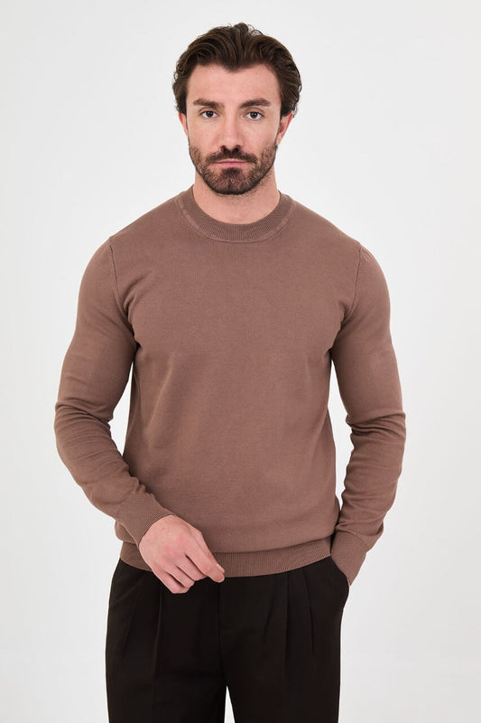 Men’s light brown cotton crewneck knit sweater styled with black trousers for fall winter fashion