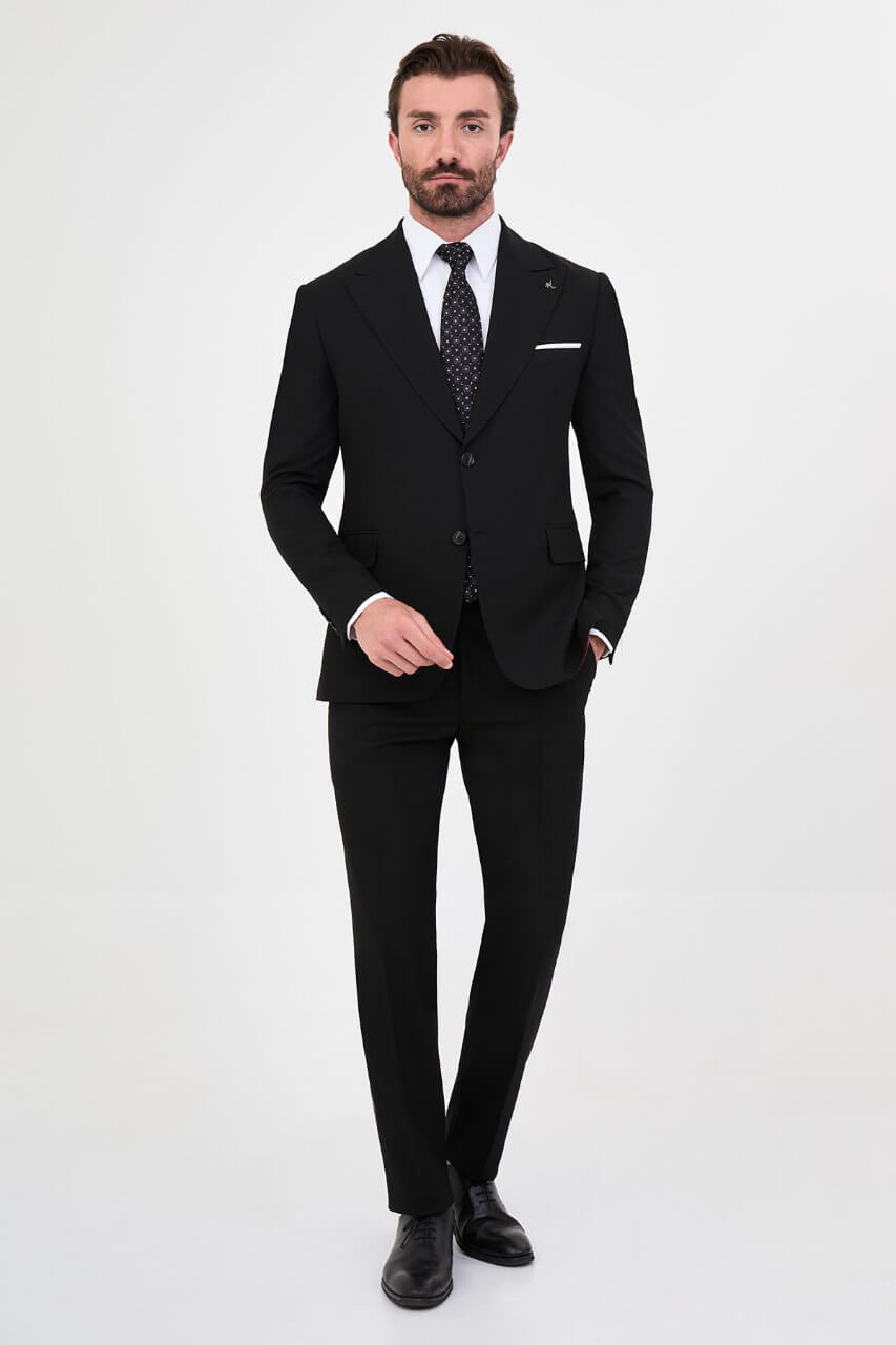Men's black slim-fit two-piece suit featuring a tailored blazer, notch lapels and matching trousers.