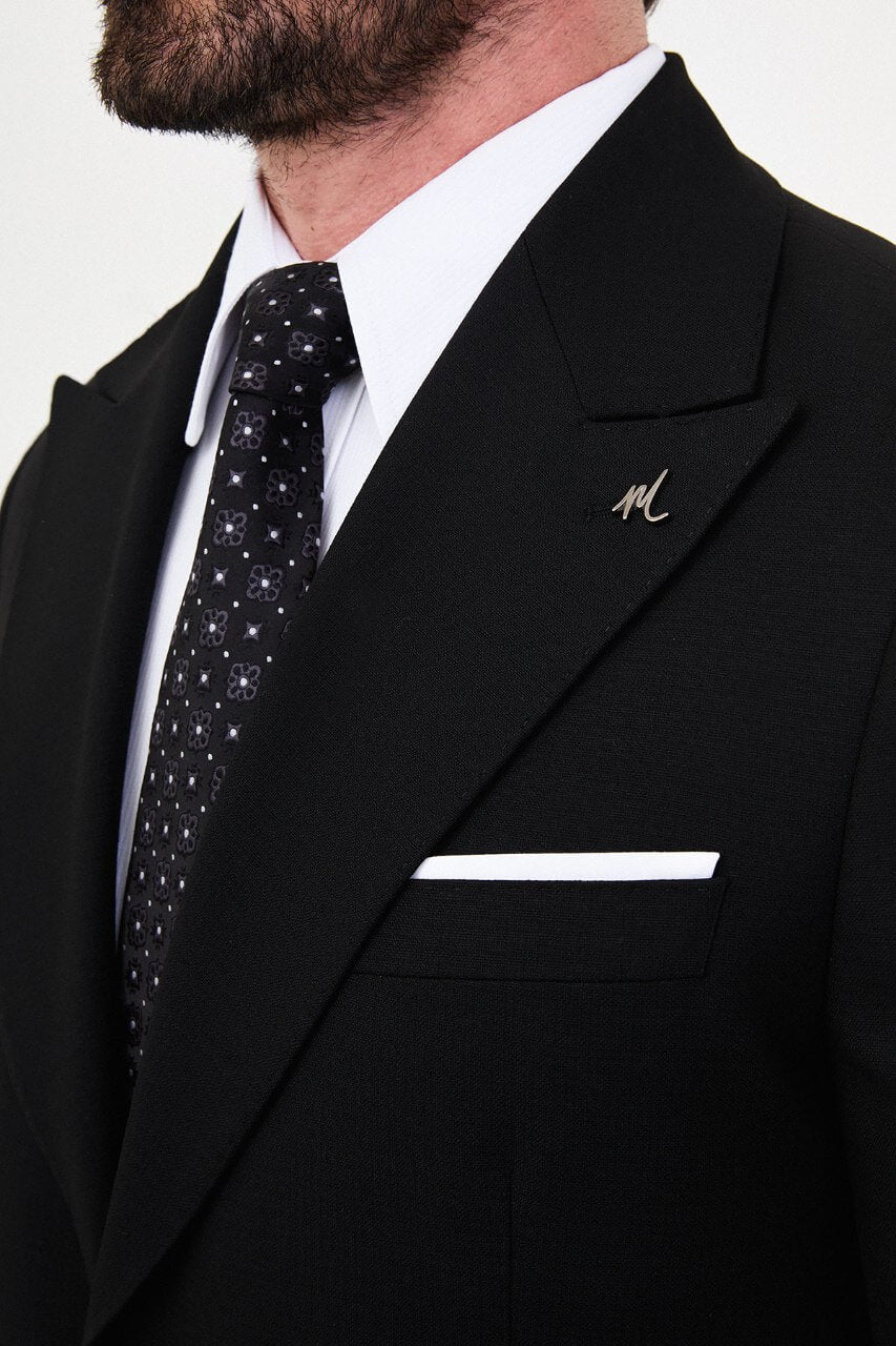 Men's black slim-fit two-piece suit featuring a tailored blazer, notch lapels and matching trousers.