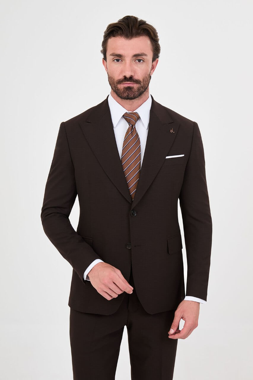 Men's brown slim-fit two-piece suit with a tailored blazer, notch lapels and matching trousers.