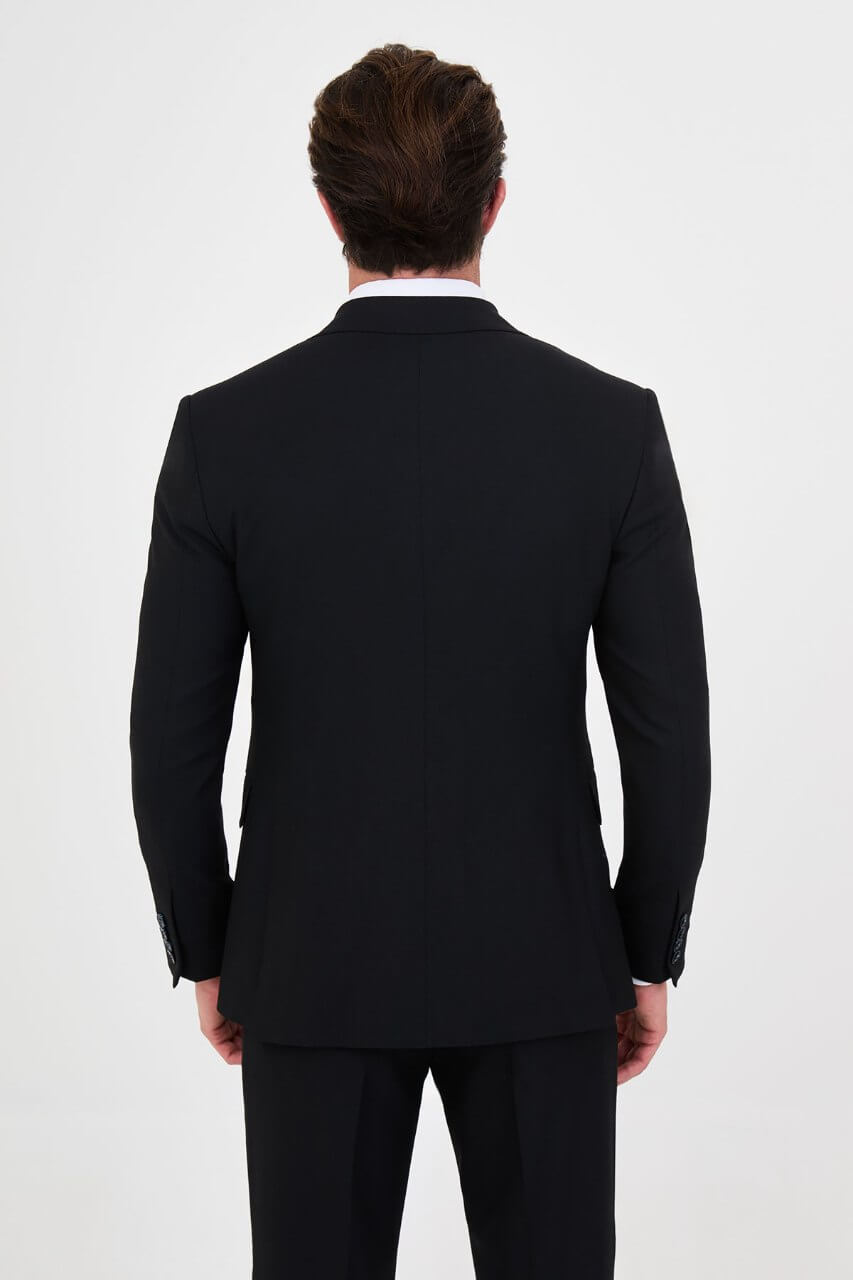 Men's navy blue slim-fit two-piece business suit featuring a tailored blazer, notch lapels and flap pockets.