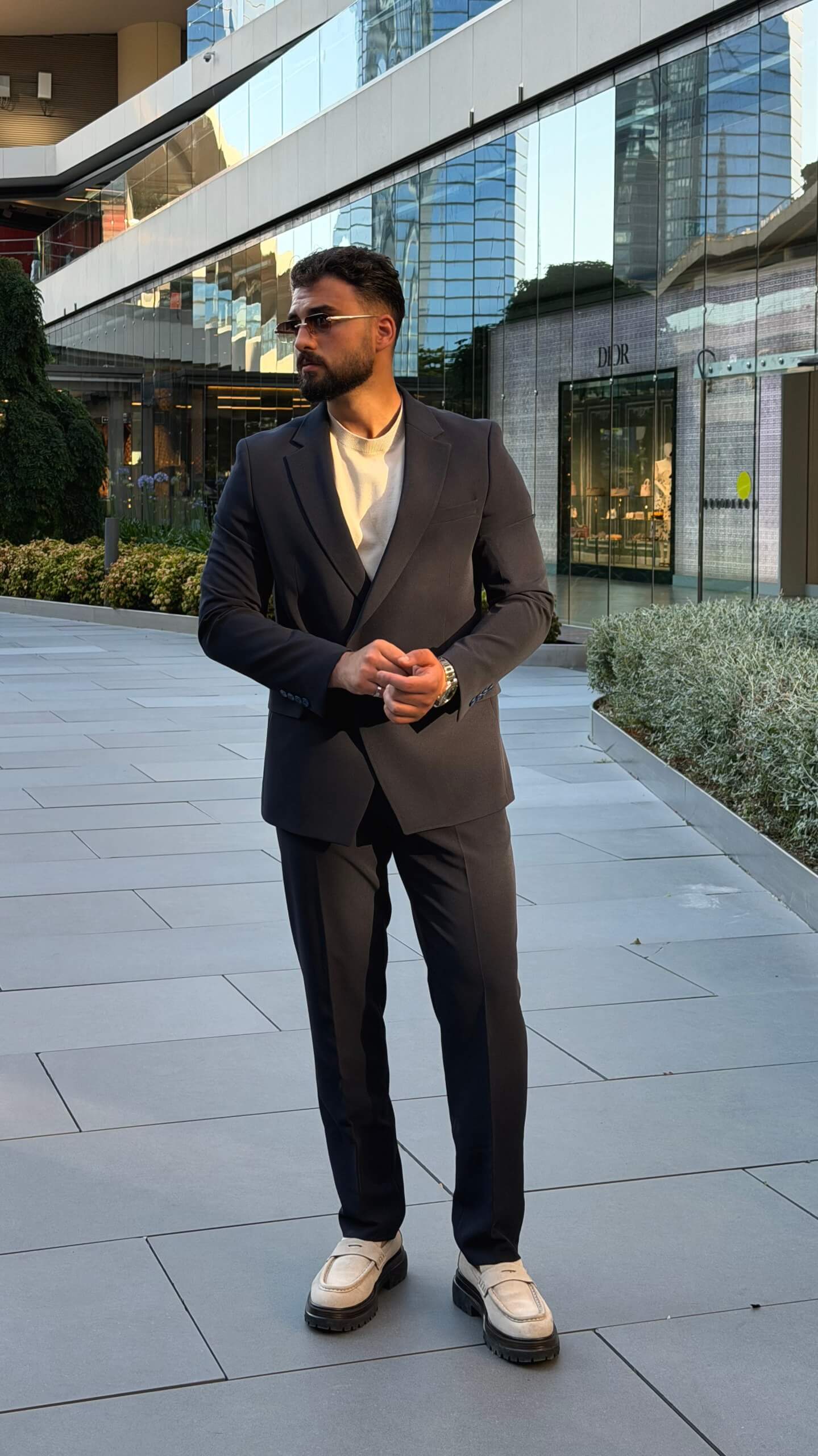 Men's navy blue single breasted suit with tailored jacket and trousers