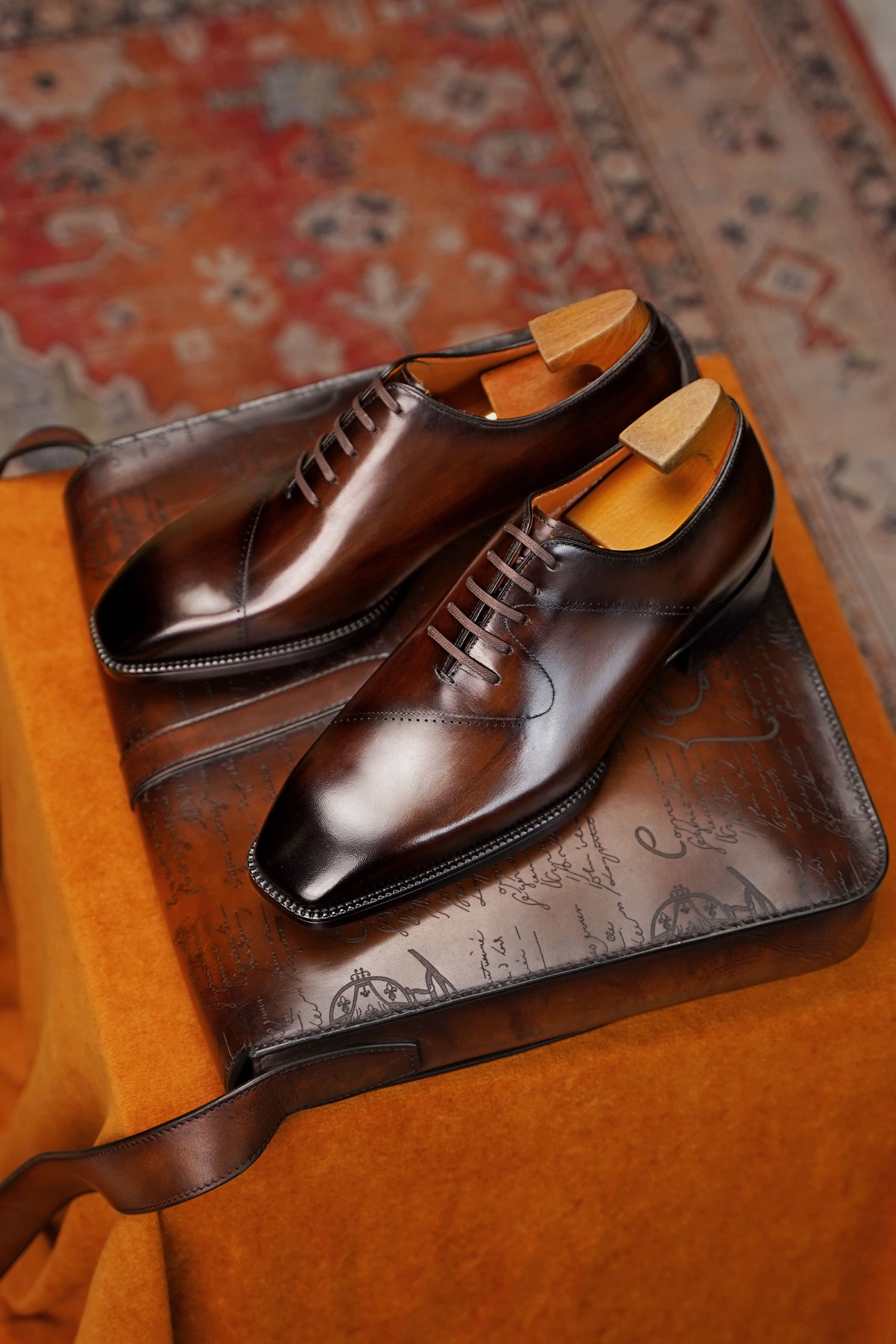 Men’s dark brown leather cap toe Oxford dress shoes featuring a polished finish, lace-up closure, sleek tapered toe, and classic formal silhouette.
