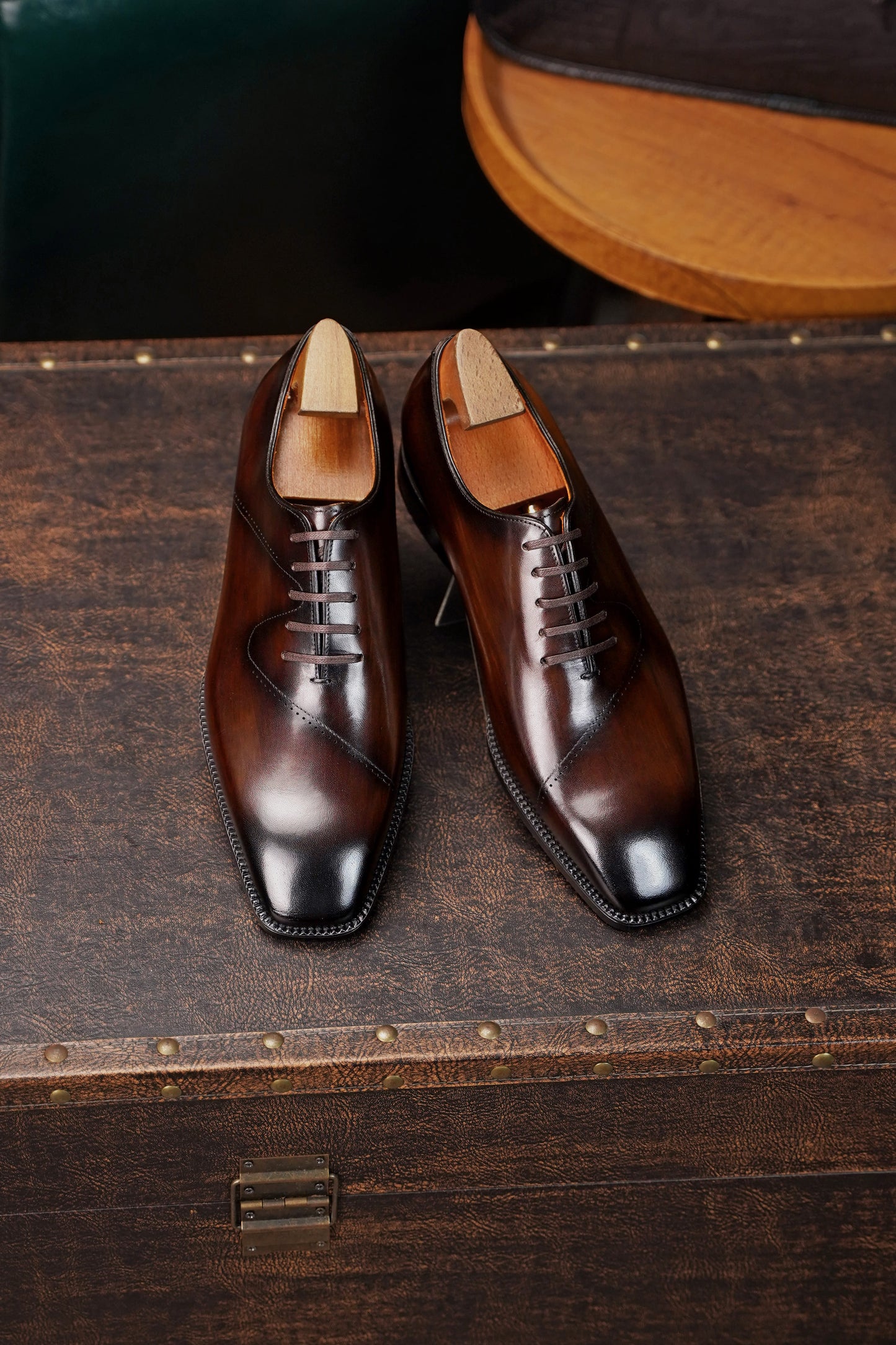 Men’s dark brown leather cap toe Oxford dress shoes featuring a polished finish, lace-up closure, sleek tapered toe, and classic formal silhouette.