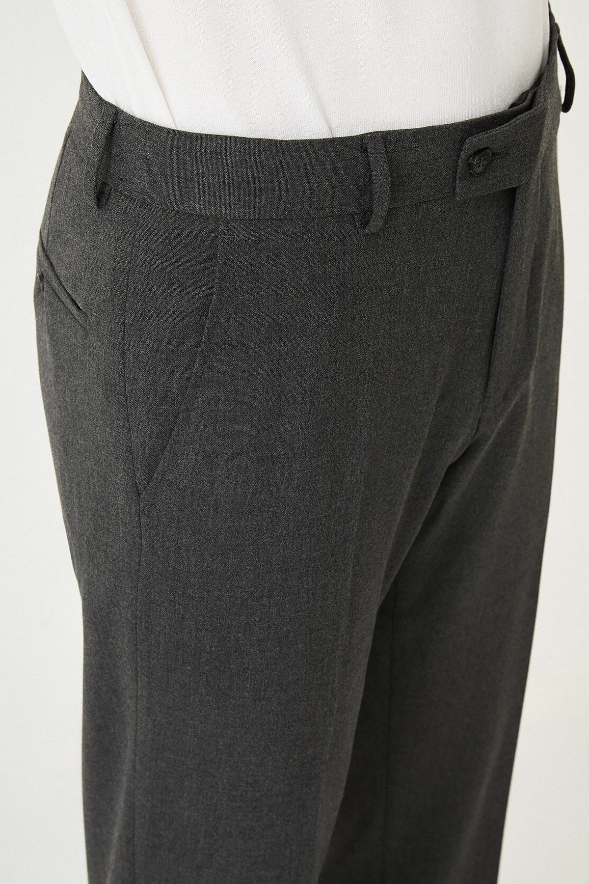 Dark Gray slim-fit formal trousers with front pleats, styled with black leather shoes, ideal for office and semi-formal summer events.