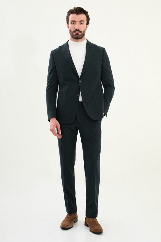 Men’s dark green slim-fit mono-collar (mandarin collar) suit with single-breasted jacket, matte micro-texture fabric, and clean minimalist tailoring designed for turtleneck layering.