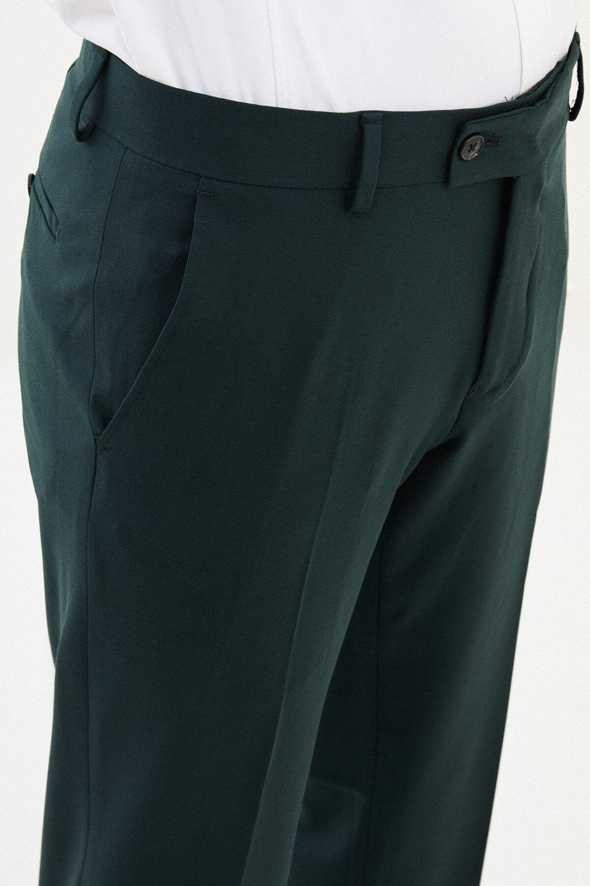 Men wearing dark grey slim-fit classic trousers, styled with formal shoes, suitable for office or business occasions.