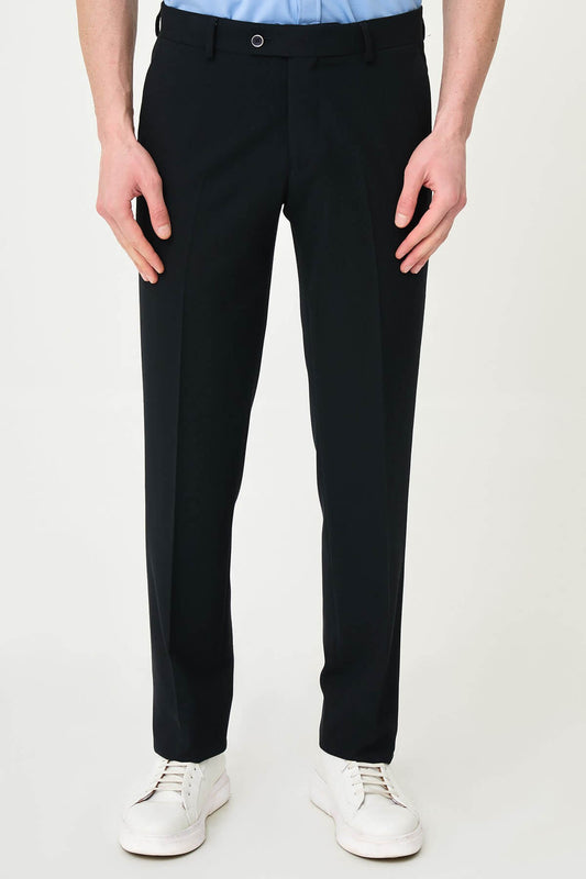 Dark Navy Blue slim-fit formal trousers with subtle pleats, styled with white sneakers, perfect for summer office.