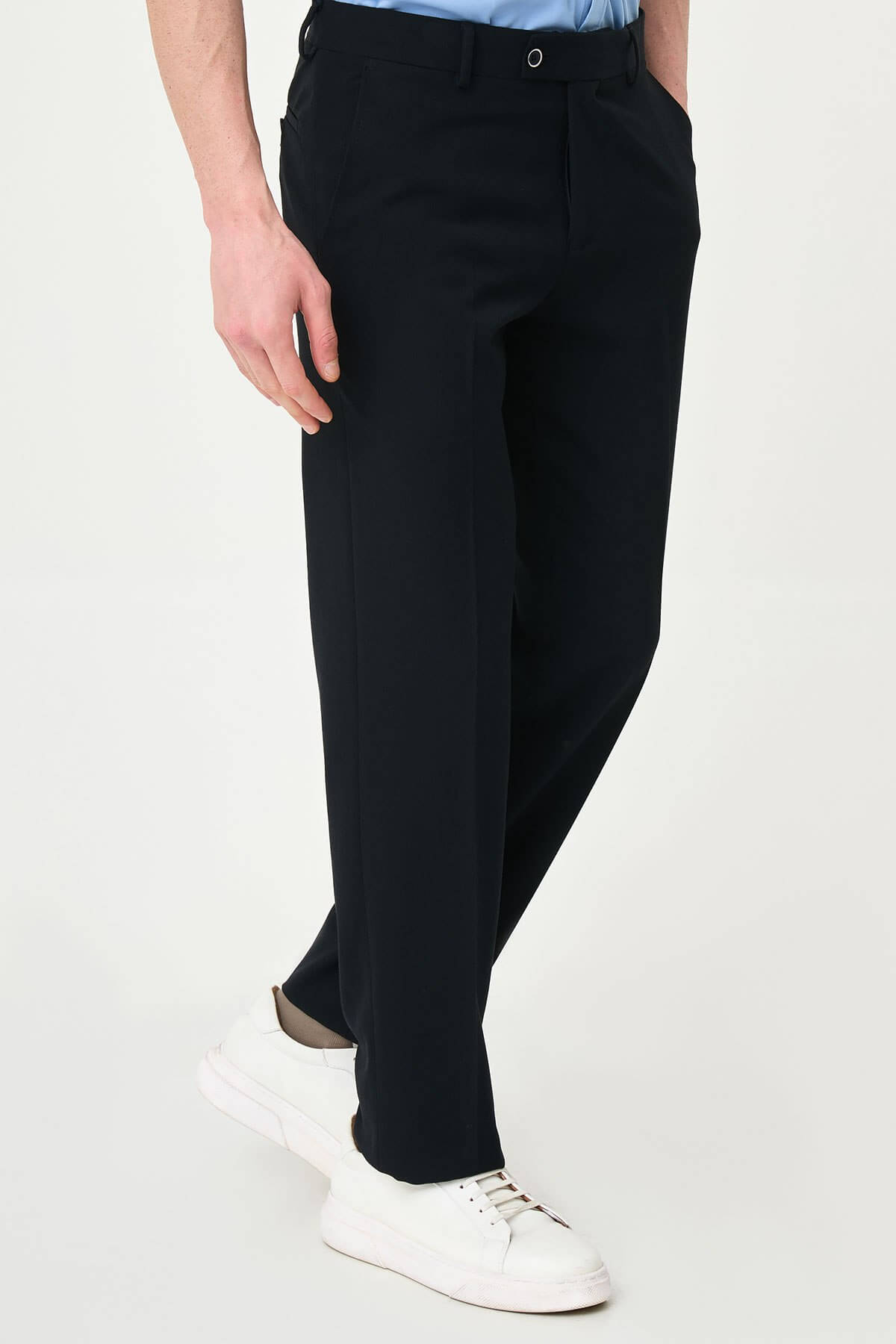 Dark Navy Blue slim-fit formal trousers with subtle pleats, styled with white sneakers, perfect for summer office.