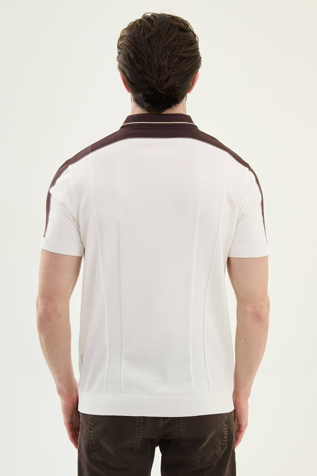 Men’s ecru colorblock slim fit knit polo shirt with contrast collar details styled for refined summer smart-casual fashion.