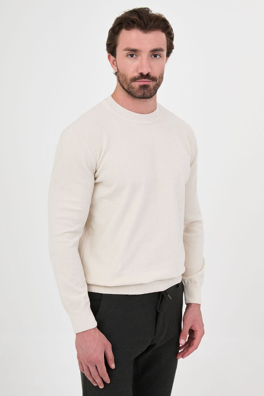 Men’s ecru crew neck knit sweater in a cotton blend slim fit design styled for a refined fall winter outfit.