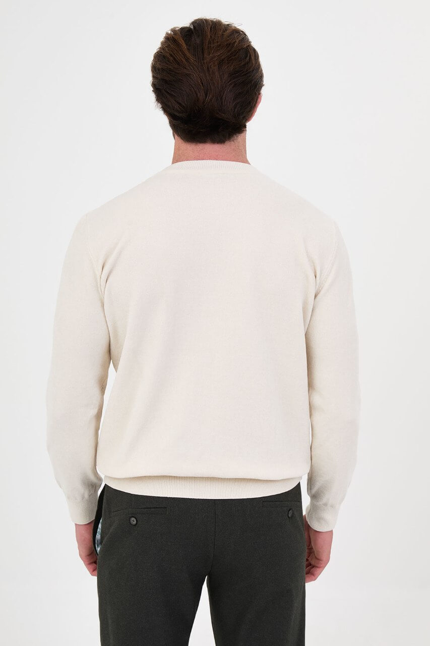 Men’s ecru crew neck knit sweater in a cotton blend slim fit design styled for a refined fall winter outfit.