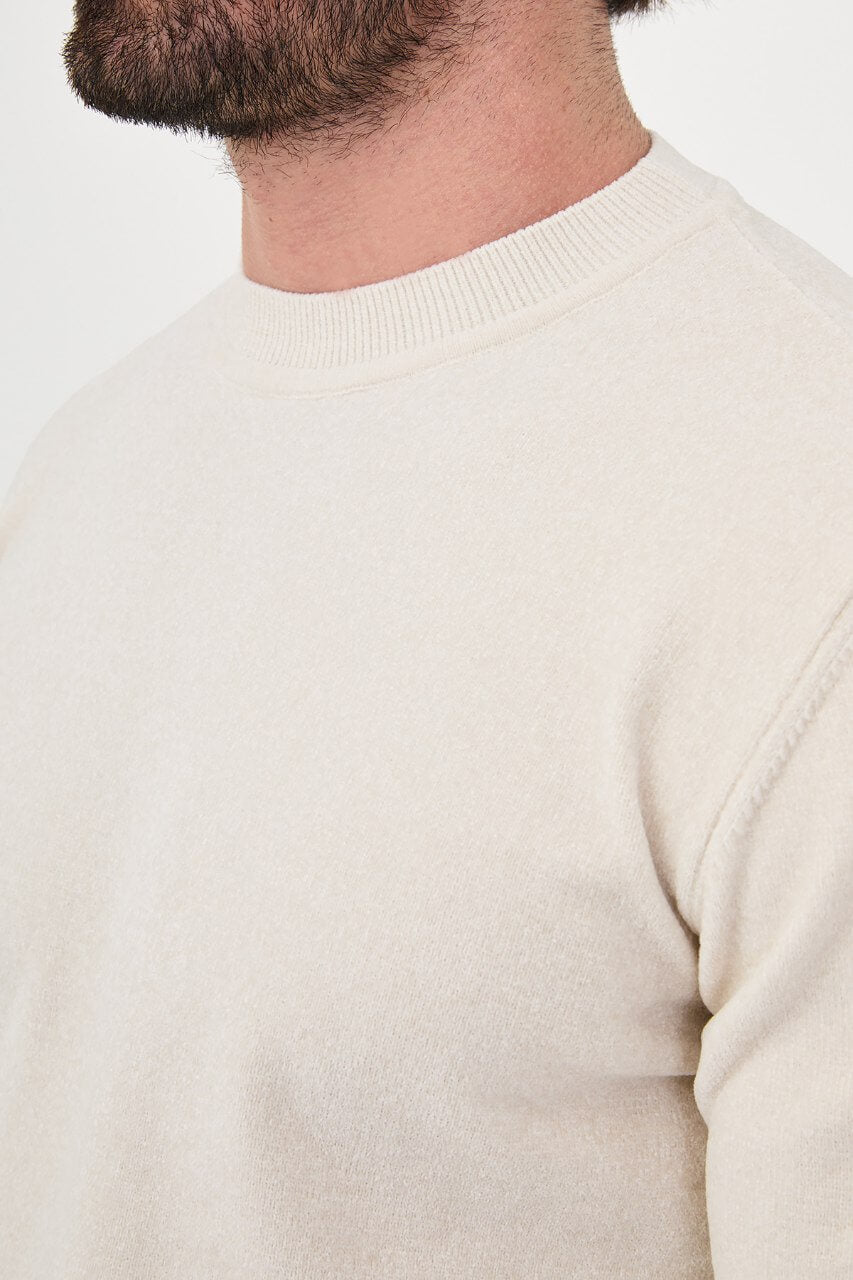 Men’s ecru crew neck knit sweater in a cotton blend slim fit design styled for a refined fall winter outfit.