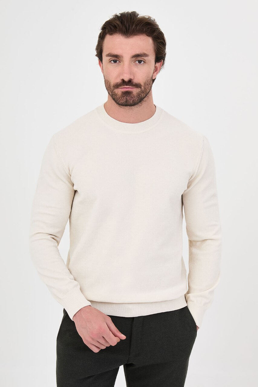 Men’s ecru crew neck knit sweater in a cotton blend slim fit design styled for a refined fall winter outfit.