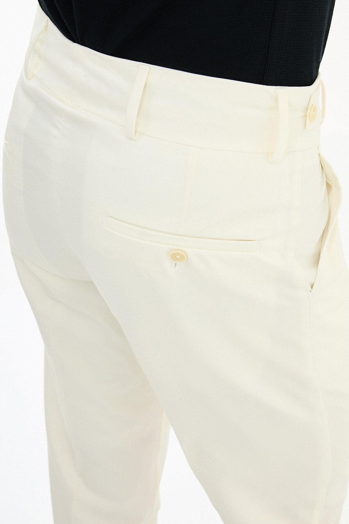 Ecru slim-fit straight-leg pleated trousers for men, styled with black leather shoes, perfect for summer formal and business wear.