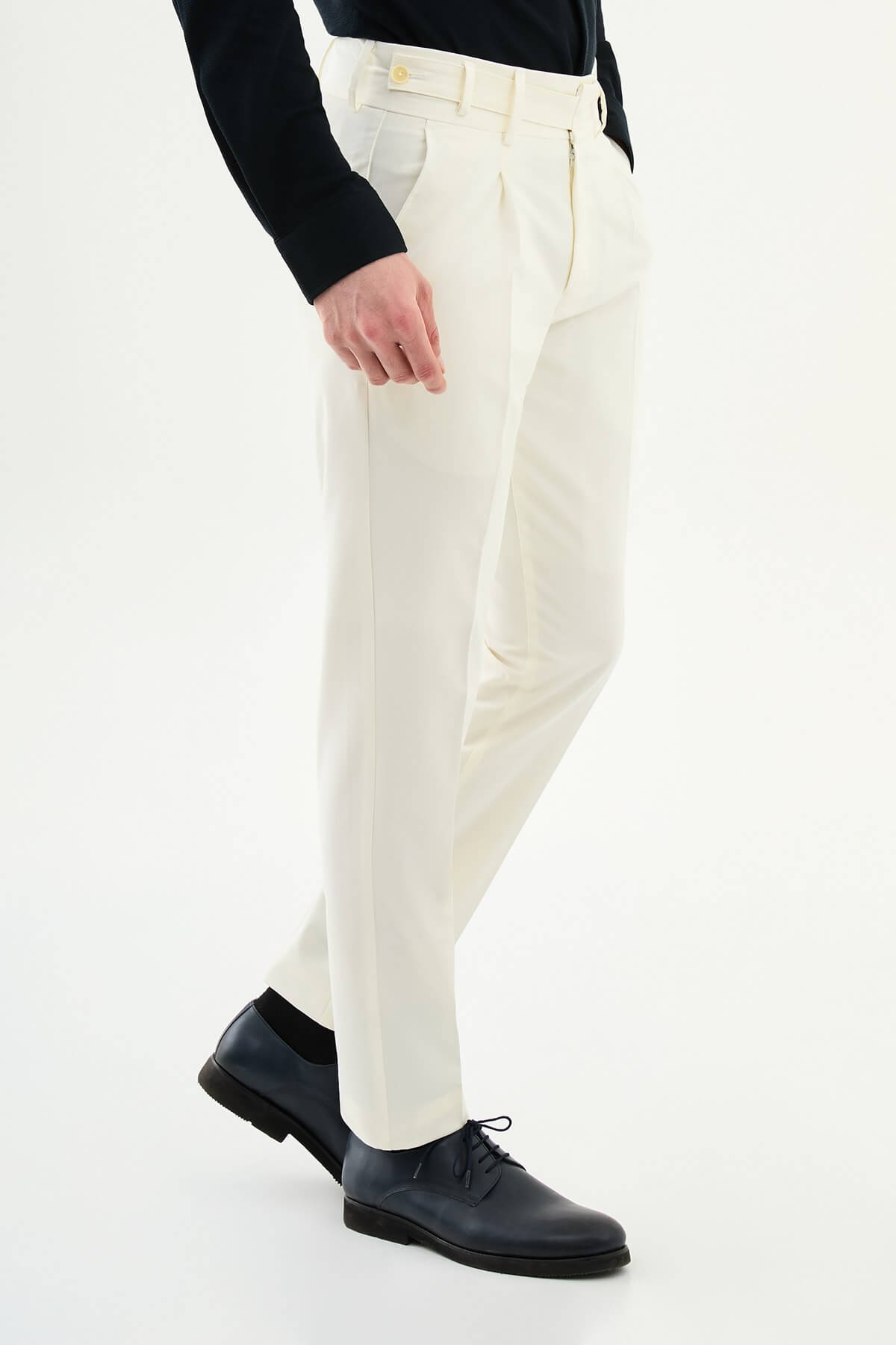 Ecru slim-fit straight-leg pleated trousers for men, styled with black leather shoes, perfect for summer formal and business wear.