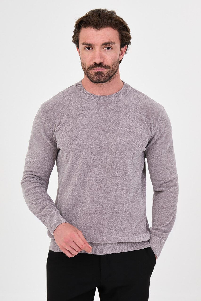 Men’s grey crew neck knit sweater in a slim fit cotton blend design styled with black trousers for a modern fall winter outfit.