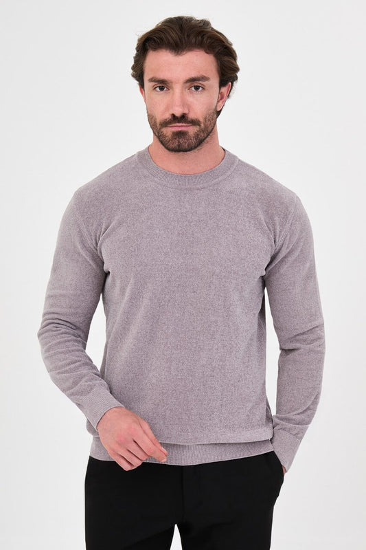 Men’s grey crew neck knit sweater in a slim fit cotton blend design styled with black trousers for a modern fall winter outfit.