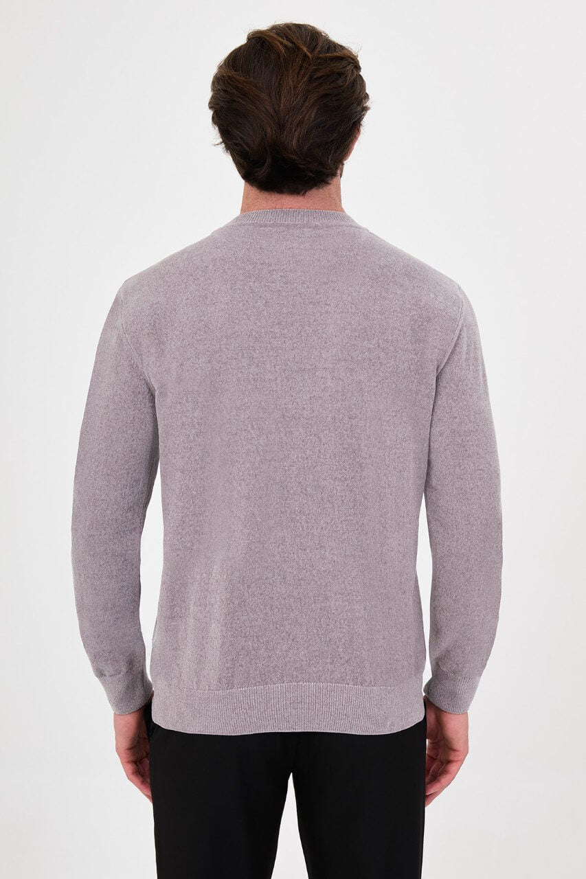 Men’s grey crew neck knit sweater in a slim fit cotton blend design styled with black trousers for a modern fall winter outfit.