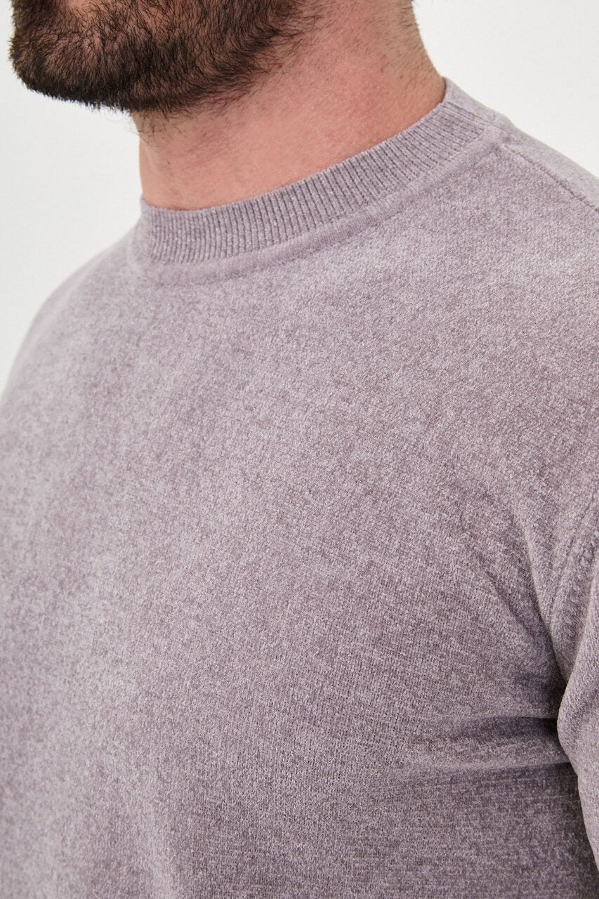 Men’s grey crew neck knit sweater in a slim fit cotton blend design styled with black trousers for a modern fall winter outfit.