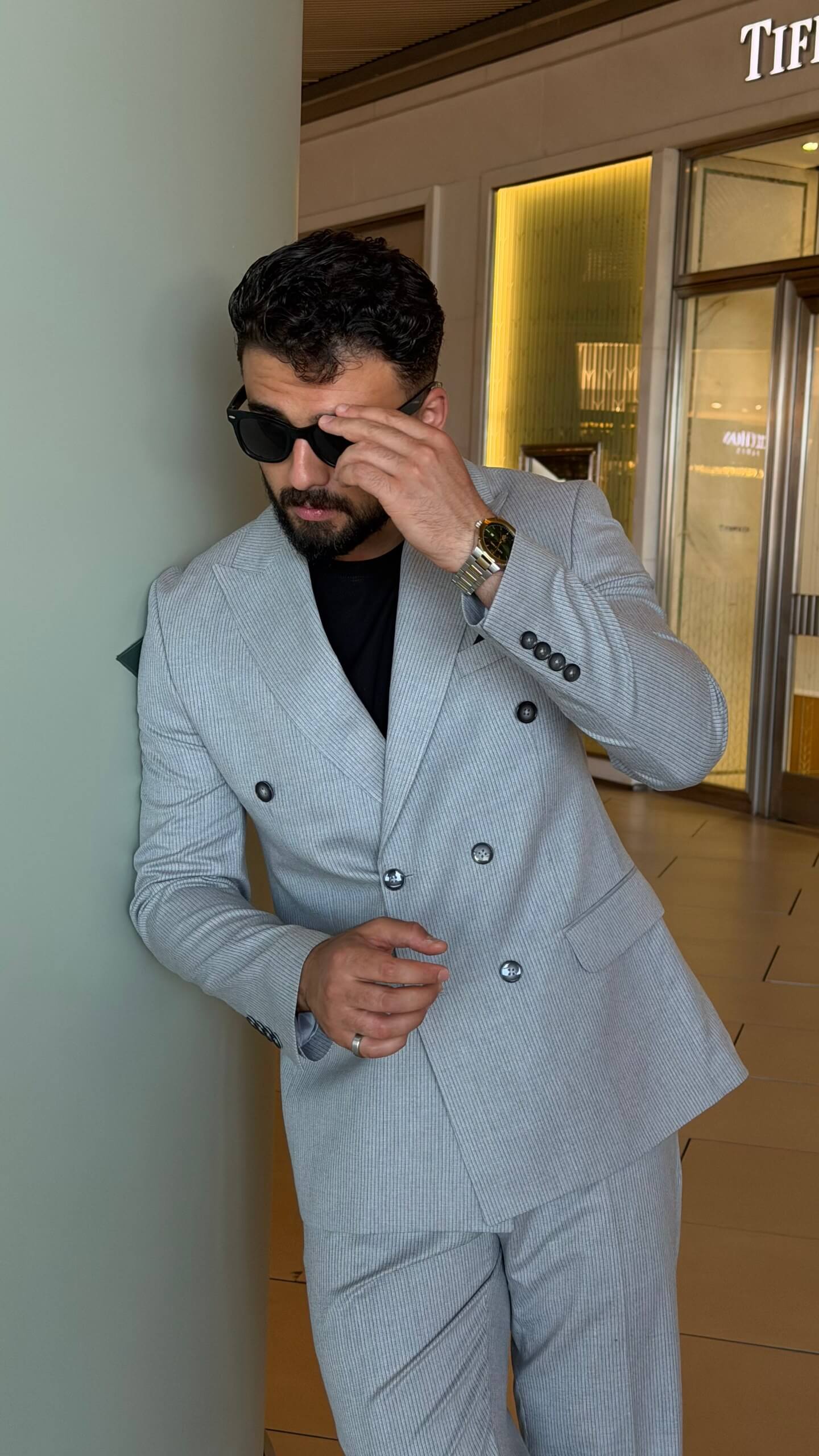 Men's gray double breasted suit with tailored jacket and matching trousers