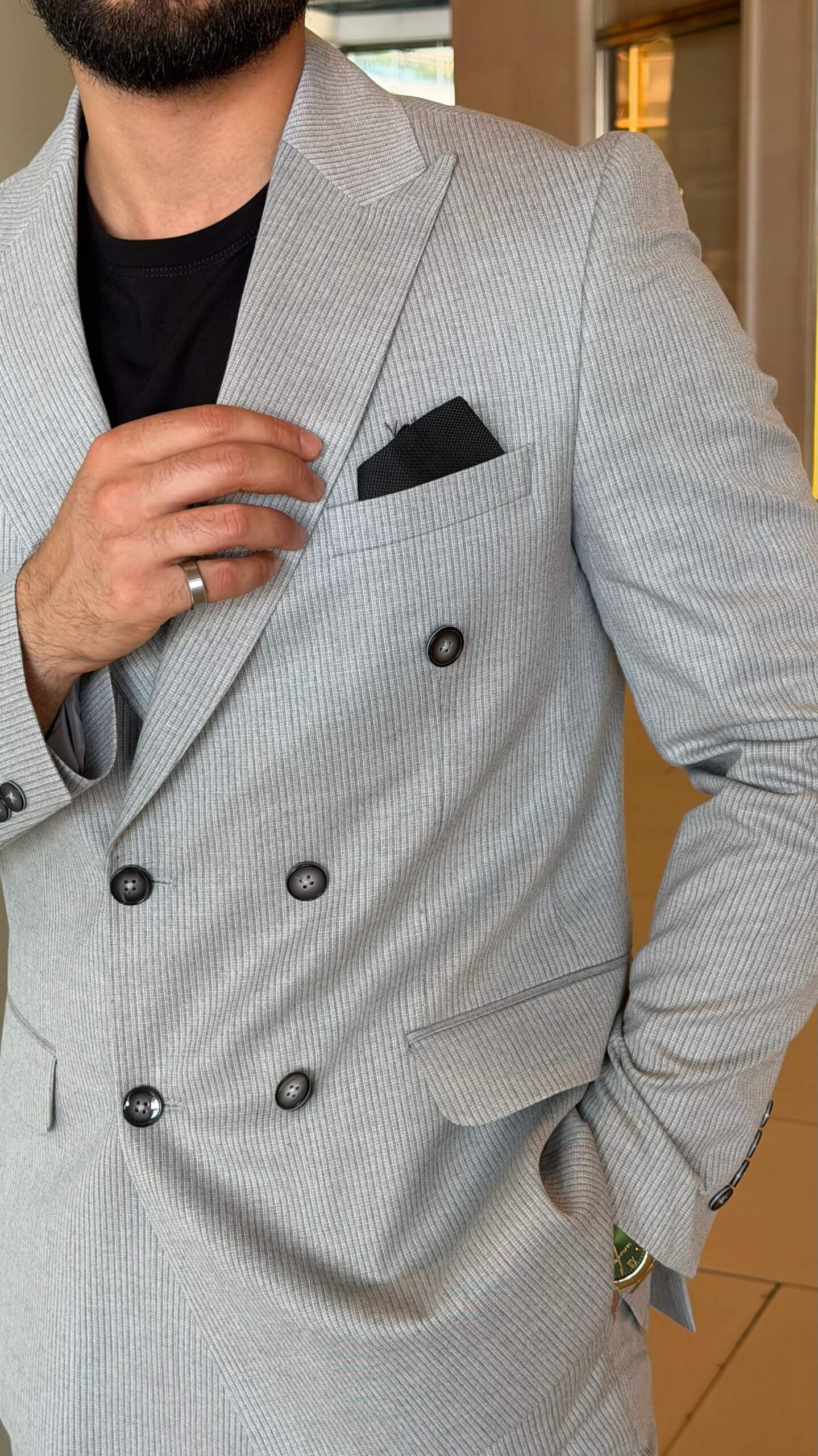 Men's gray double breasted suit with tailored jacket and matching trousers
