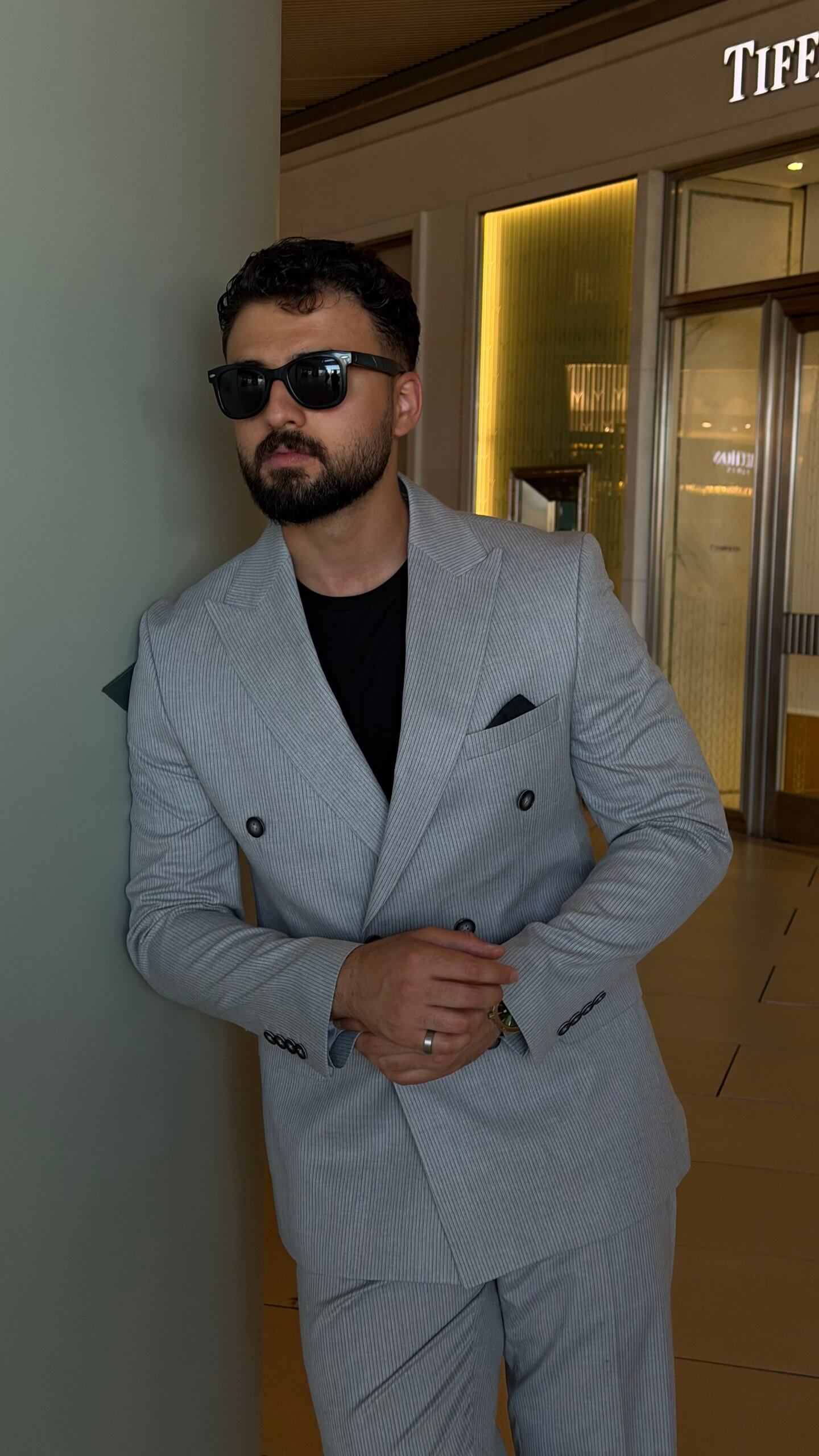 Men's gray double breasted suit with tailored jacket and matching trousers