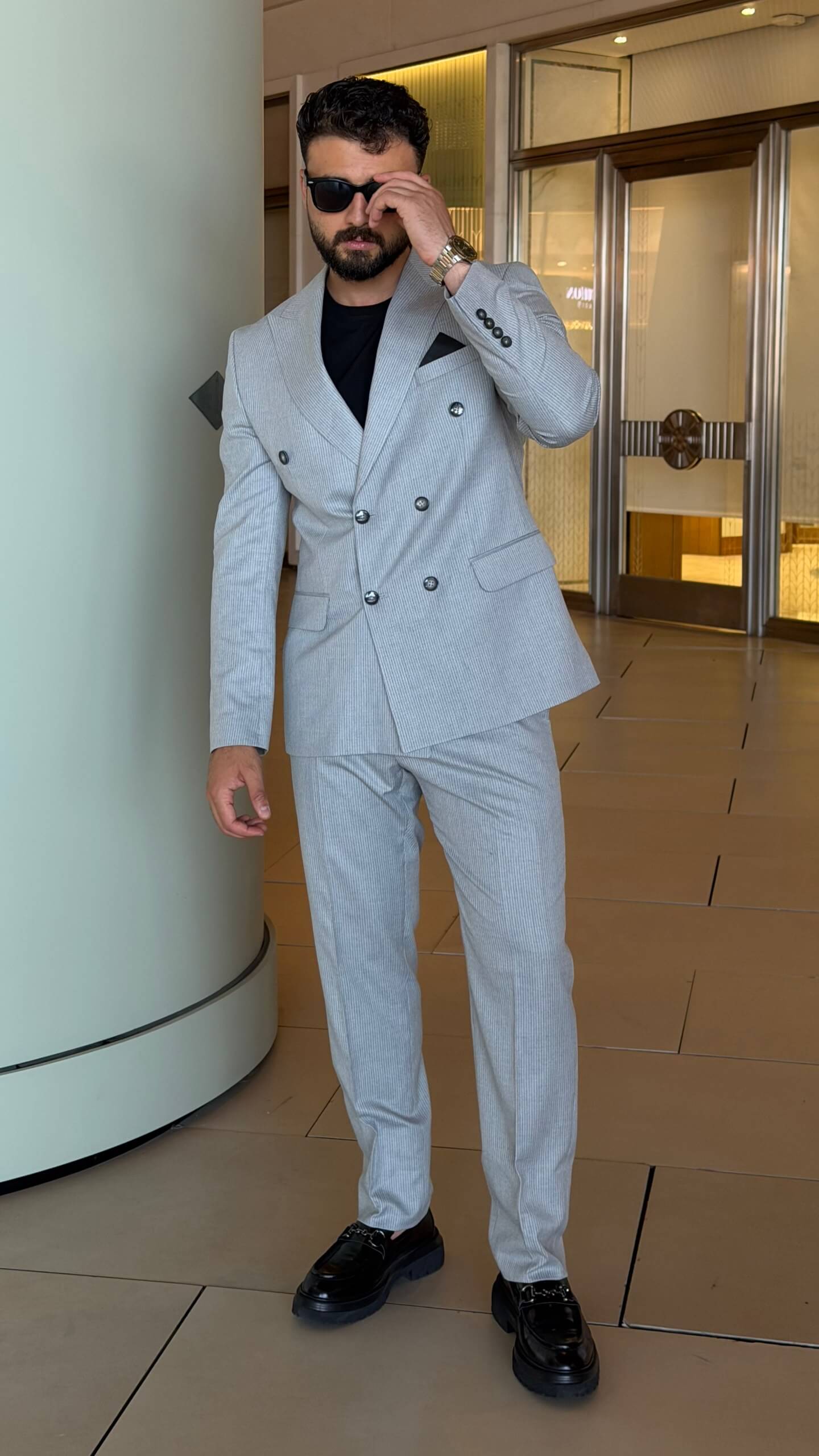 Men's gray double breasted suit with tailored jacket and matching trousers