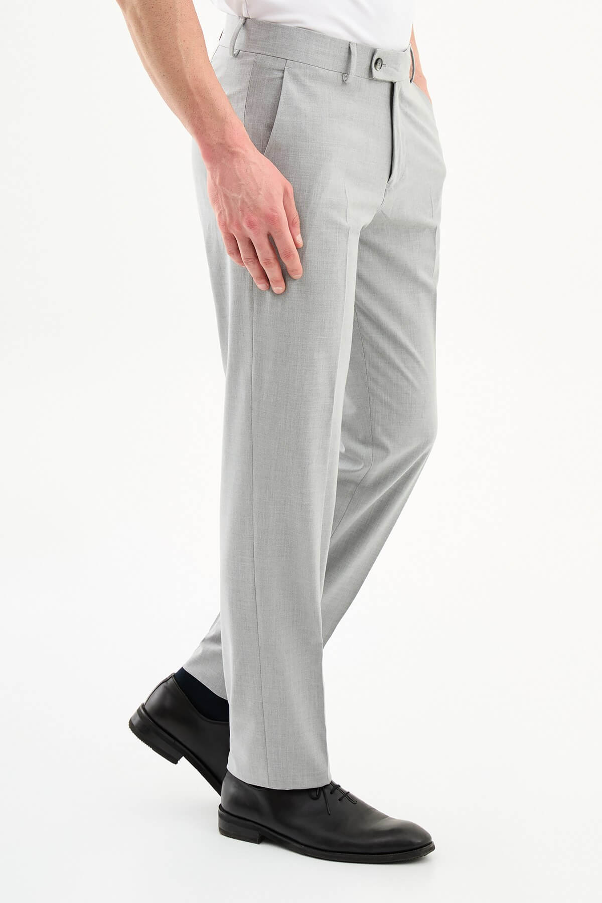 Men wearing gray slim-fit formal trousers with black dress shoes, styled for summer office and formal occasions.