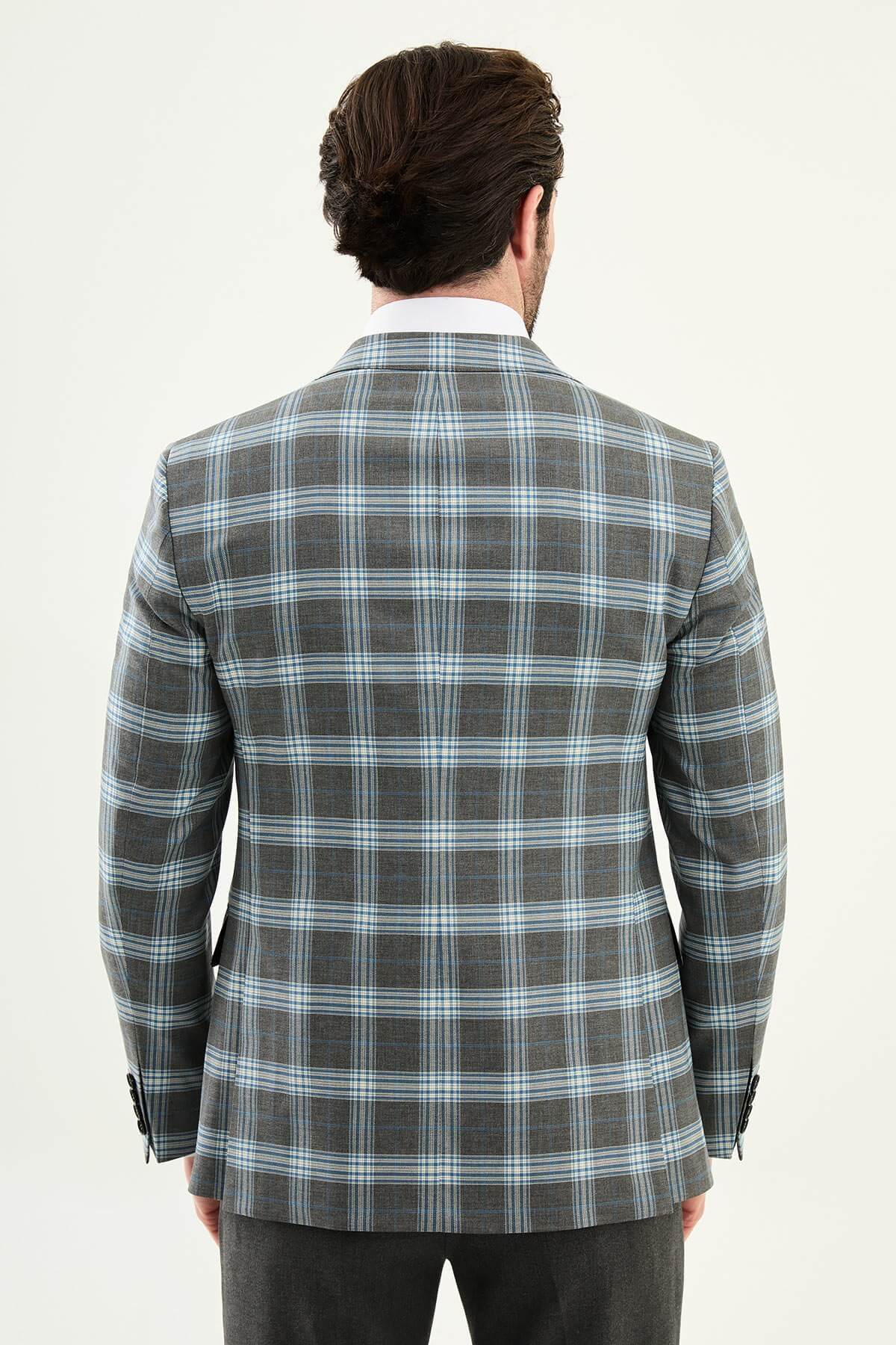 Men’s Gray Plaid Slim Fit Suit on model, paired with a navy tie.