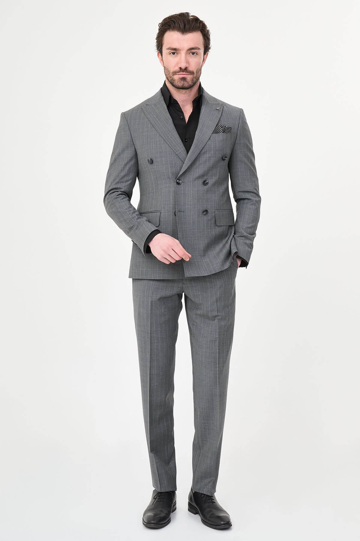 Men’s Gray Pinstripe Double-Breasted Suit, showing slim-fit trousers and black oxford shoes.
