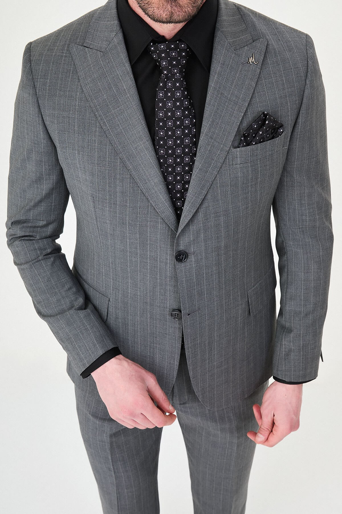 Man wearing Men’s Gray Slim-Fit Wide Collar Premium Wool Suit, styled with formal shoes and a dress shirt, ideal for summer weddings and business events.