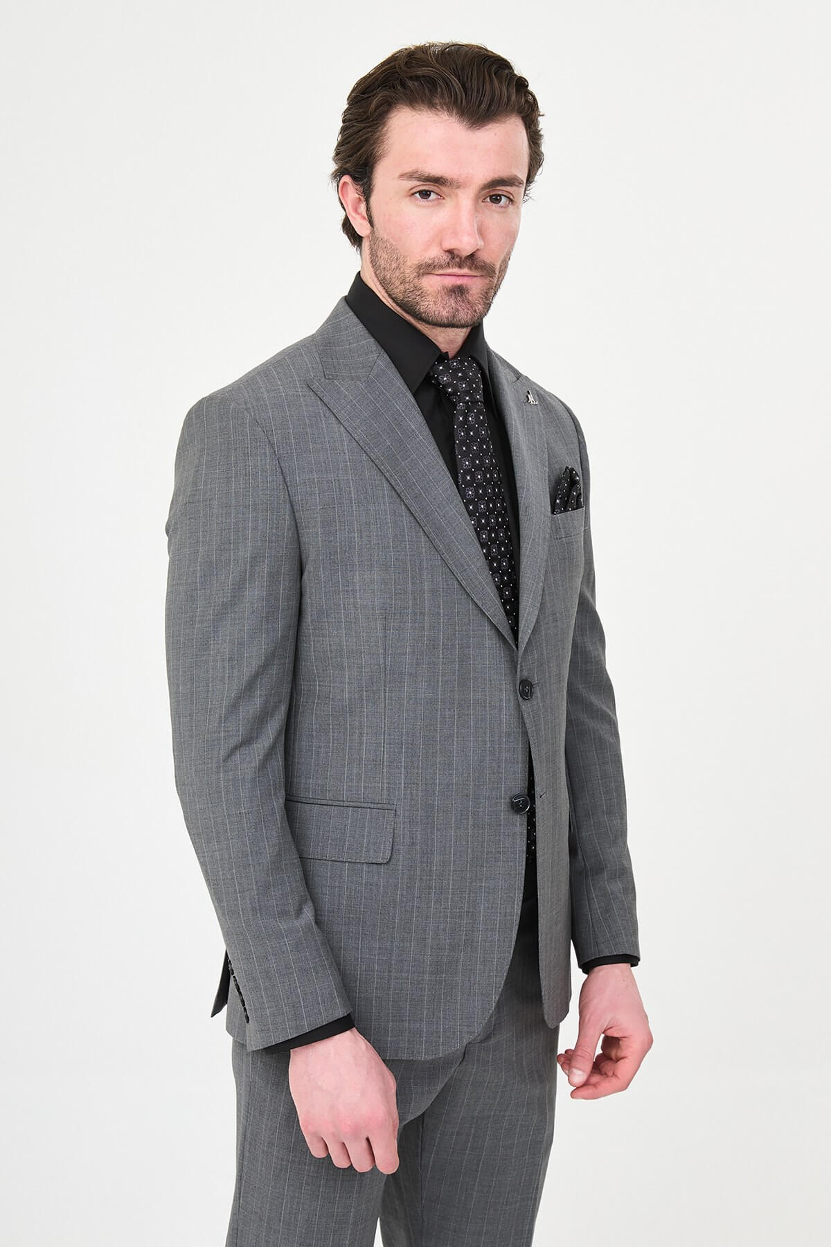 Man wearing Men’s Gray Slim-Fit Wide Collar Premium Wool Suit, styled with formal shoes and a dress shirt, ideal for summer weddings and business events.
