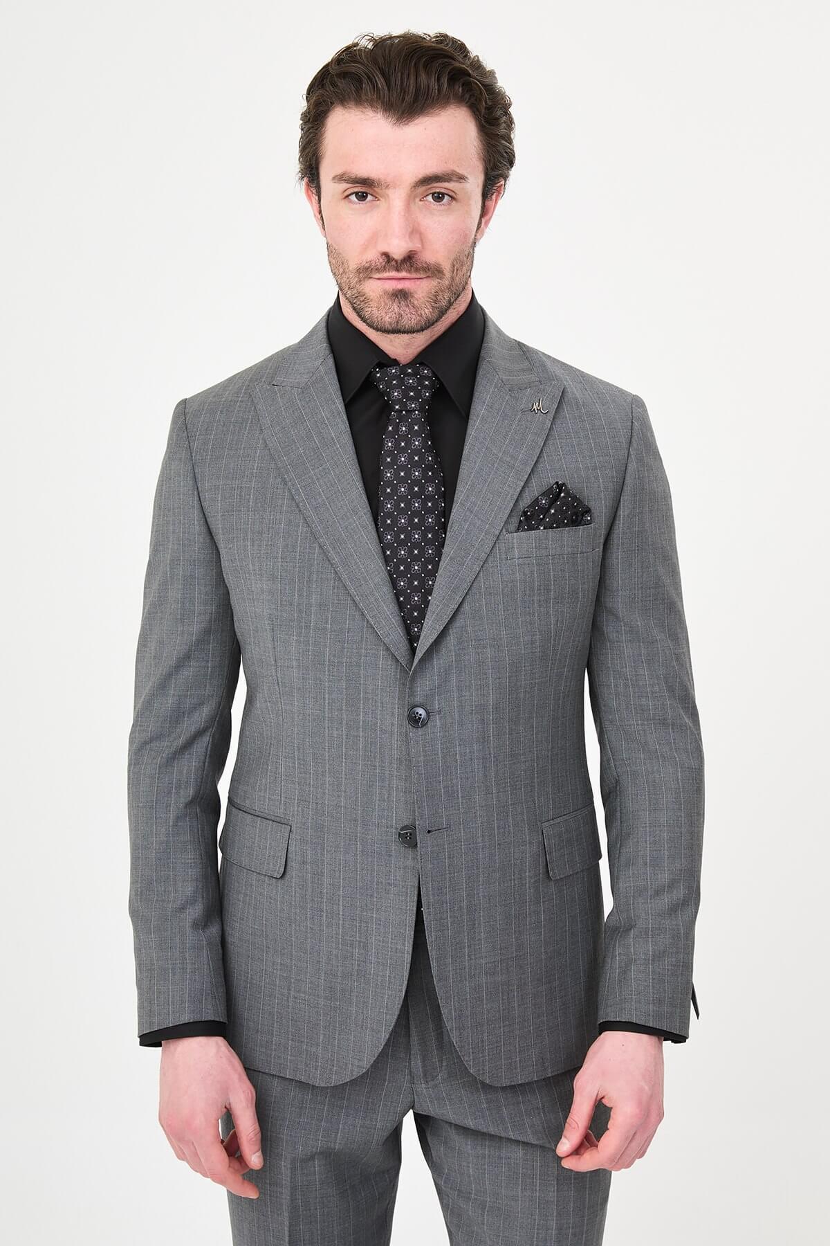 Man wearing Men’s Gray Slim-Fit Wide Collar Premium Wool Suit, styled with formal shoes and a dress shirt, ideal for summer weddings and business events.