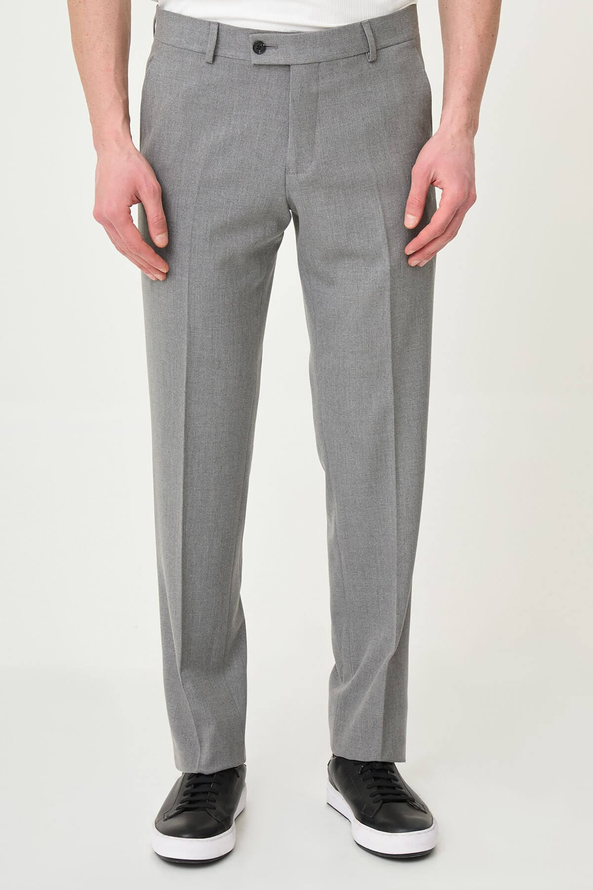 Gray slim-fit formal trousers with front pleats, styled with black or brown leather shoes, ideal for summer office and semi-formal occasions.