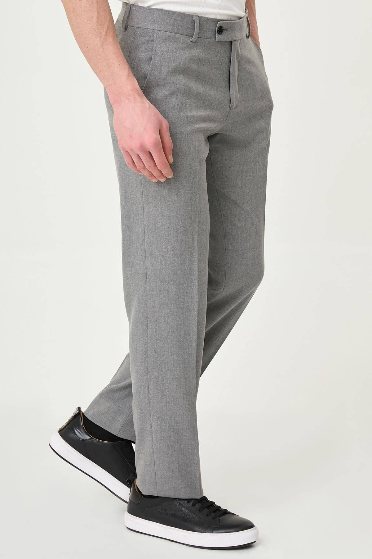 Gray slim-fit formal trousers with front pleats, styled with black or brown leather shoes, ideal for summer office and semi-formal occasions.