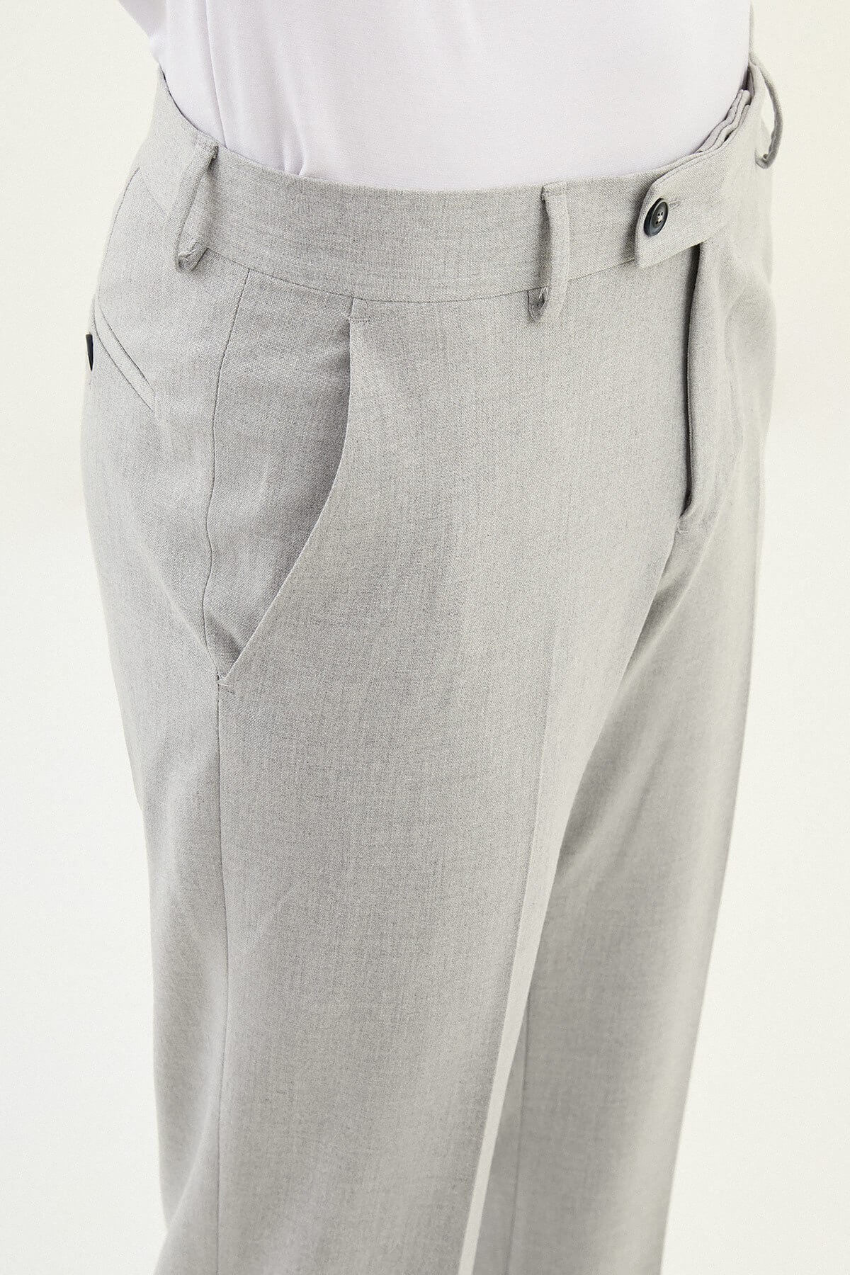 Gray slim-fit formal trousers with front pleats, styled with black leather shoes, ideal for summer office and semi-formal events.