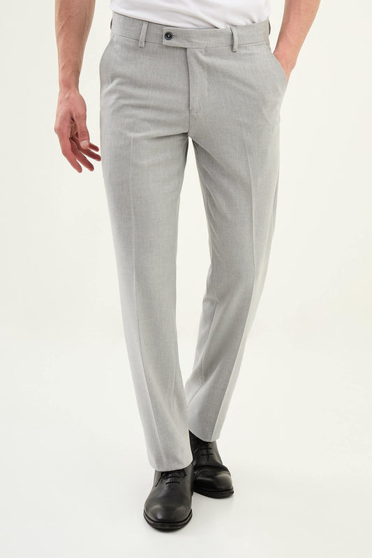 Gray slim-fit formal trousers with front pleats, styled with black leather shoes, ideal for summer office and semi-formal events.