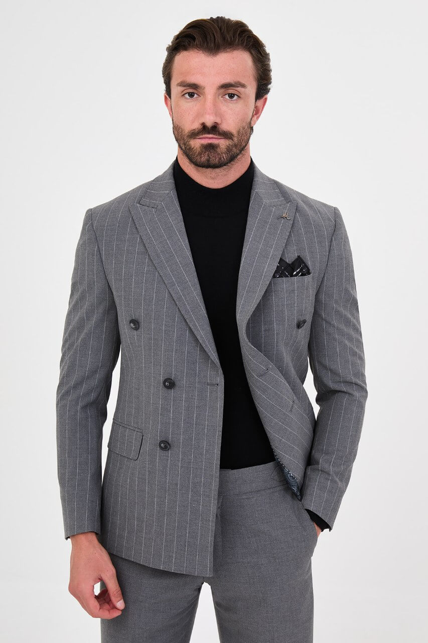 HolloMen men's grey pinstripe double-breasted suit with peak lapels, six-button jacket, and matching trousers styled with a black turtleneck.