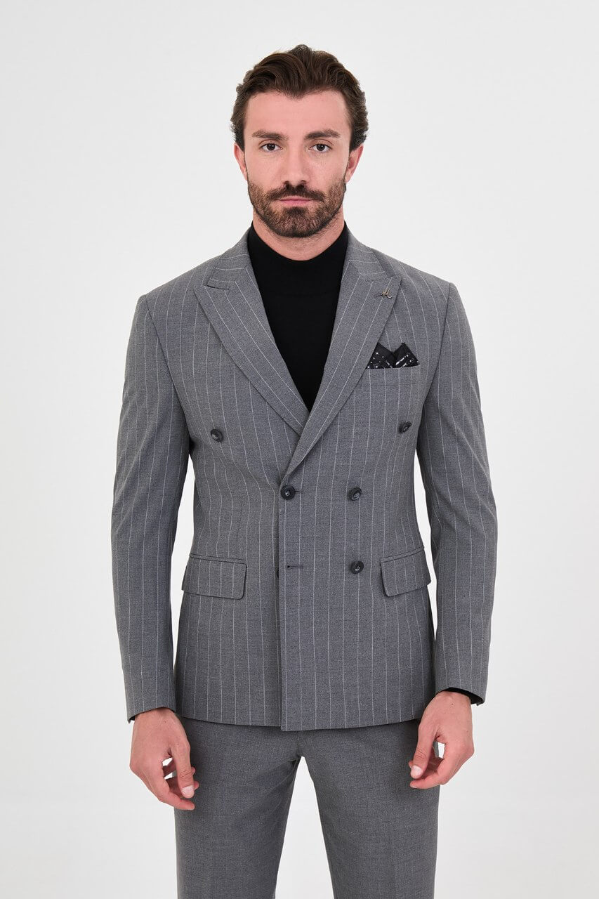 HolloMen men's grey pinstripe double-breasted suit with peak lapels, six-button jacket, and matching trousers styled with a black turtleneck.