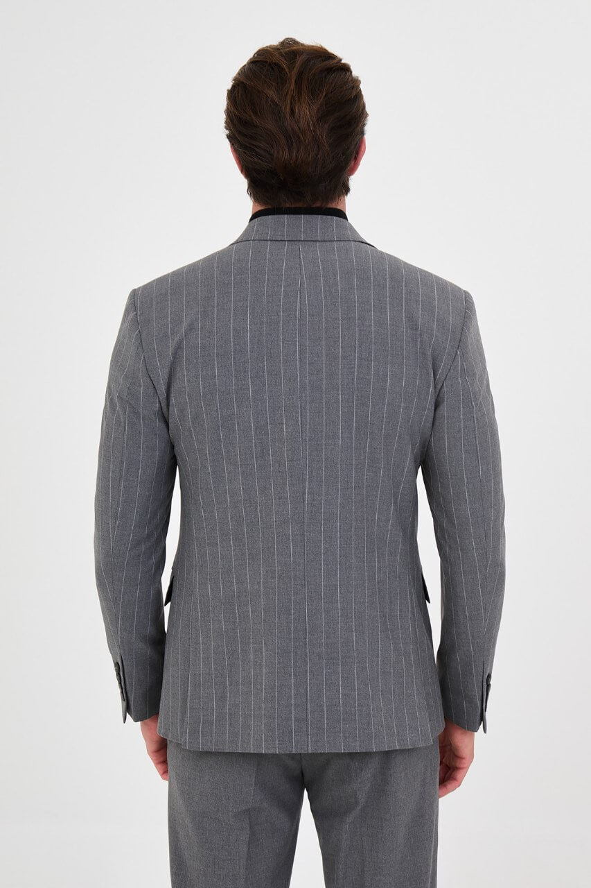 HolloMen men's grey pinstripe double-breasted suit with peak lapels, six-button jacket, and matching trousers styled with a black turtleneck.