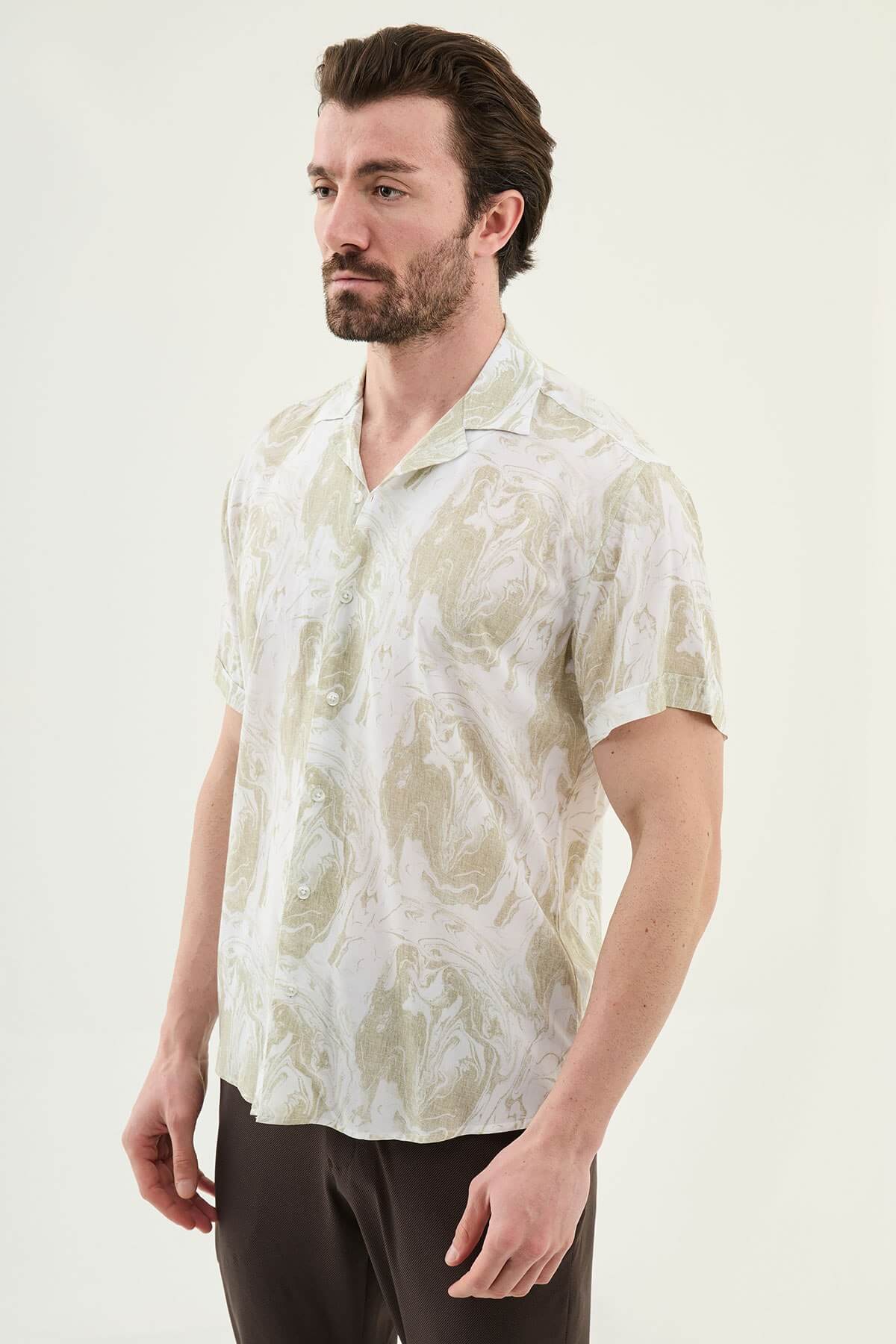 Men wearing a green palm tree printed slim-fit short sleeve shirt, styled for summer casual outings, front view.