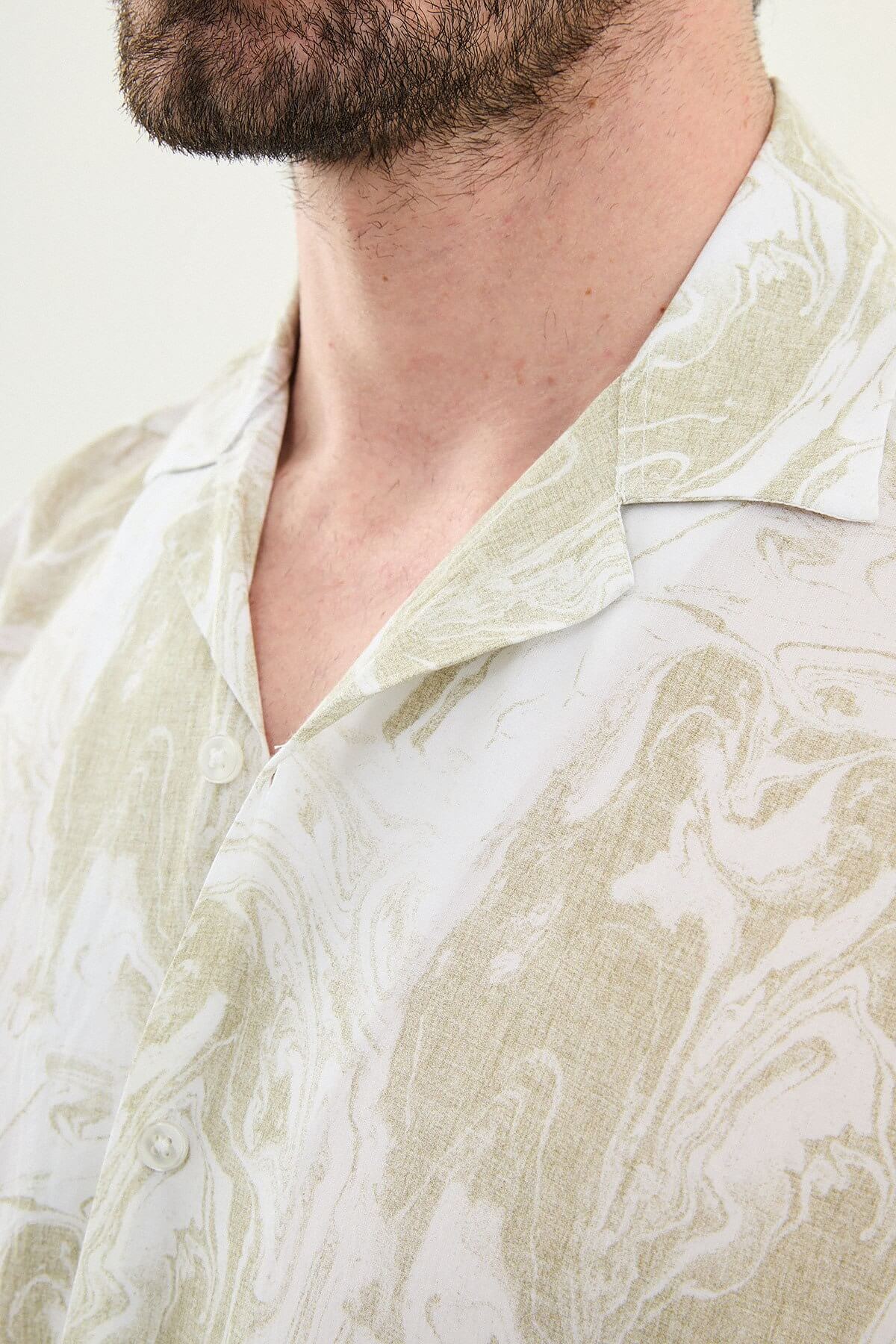Men wearing a green palm tree printed slim-fit short sleeve shirt, styled for summer casual outings, front view.