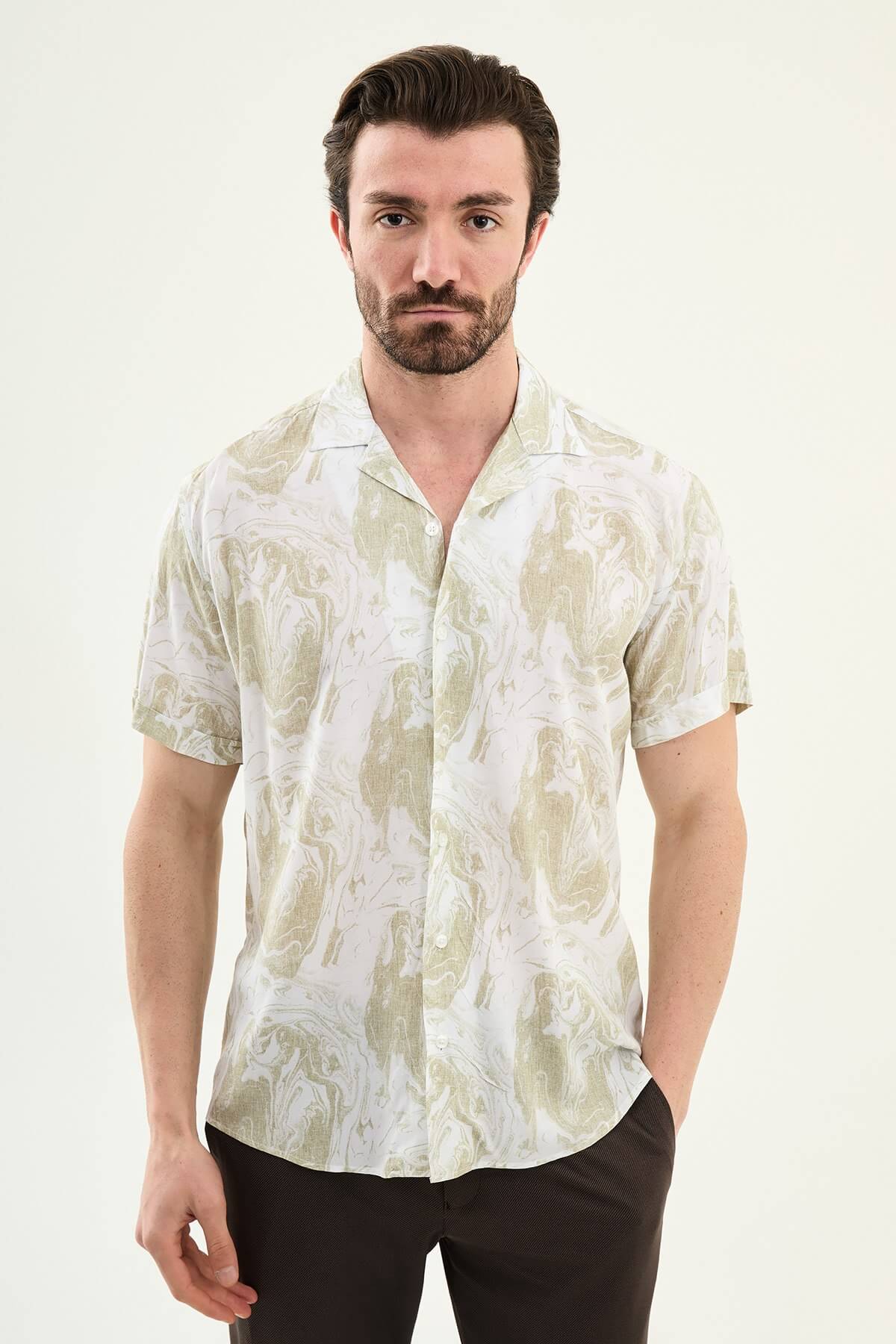 Men wearing a green palm tree printed slim-fit short sleeve shirt, styled for summer casual outings, front view.