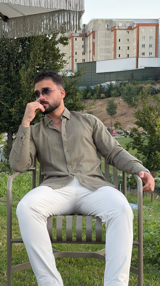 Men’s green textured cotton long sleeve casual shirt styled with white trousers for a smart casual outfit