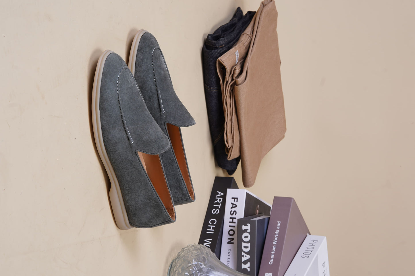Men’s grey suede leather casual slip-on loafers with moccasin stitching and lightweight sole.